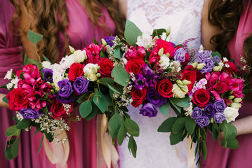Bridal morning details. Wedding bouquet in the hands of the bride, selectoin focus
