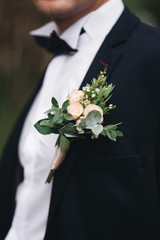 Wedding groom’s accessories, boutonniere,selection focus