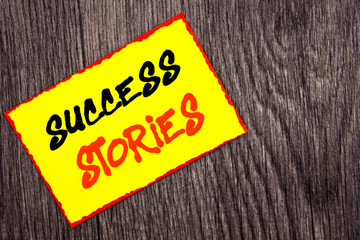 Conceptual hand writing text showing Success Stories. Concept meaning Successful Inspiration Achievement Education Growth written on Yellow Sticky Note Paper on the wooden background.