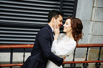 Sensual wedding Couple, groom and bride, holds each other and laughing