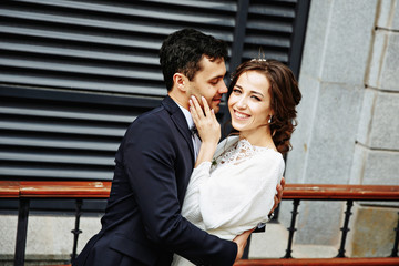 Sensual wedding Couple, groom and bride, holds each other and laughing