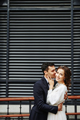 Sensual wedding Couple, groom and bride, holds each other and laughing