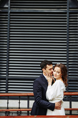 Sensual wedding Couple, groom and bride, holds each other and laughing