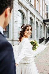 bride and groom walking around the city