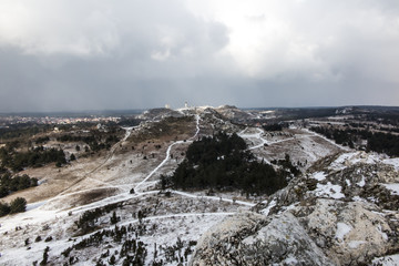 View towards the ruins of the castle in Olsztyn. Landscape with the rocks of the Krakow-Czestochowa Jura covered with a small amount of snow