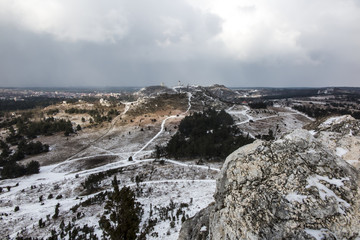 View towards the ruins of the castle in Olsztyn. Landscape with the rocks of the Krakow-Czestochowa Jura covered with a small amount of snow