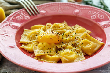 Ravioli with ricotta and Parmesan cheese in a plate.