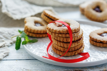 Homemade Linzer cookies in the shape of a heart.