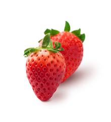 Strawberries fresh arrangement with green leaves closeup isolated on white background in studio