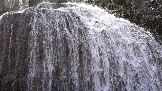 Waterfall at slow motion in the stone monastery