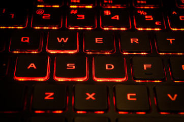 Red keyboard backlight of gaming computer © LukeS