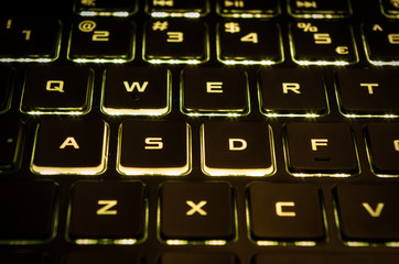 Yellow keyboard backlight of gaming computer © LukeS