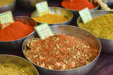 Bowls of different spices on the market