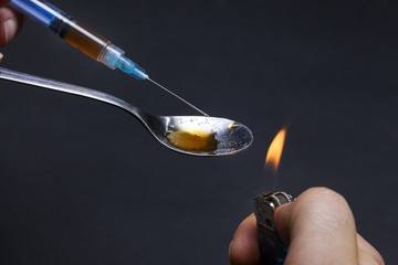 Addict preparing drugs