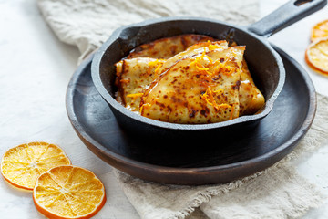Crepe Suzette with orange sauce.