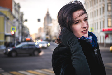 Fototapeta premium close up young lady in the winter street wearing scarf and coat