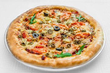 round pizza on a white plate