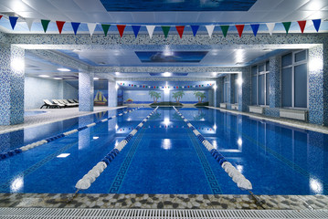 Public competition swimming pool interior in fitness gym club