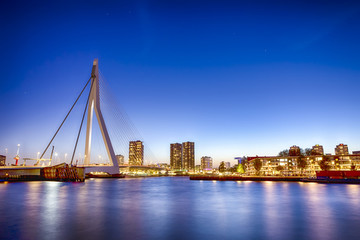 Fototapeta na wymiar Travel Concepts. View of Unique and Beautiful Erasmus Bridge in Rotterdam. Shot During Blue Hour.