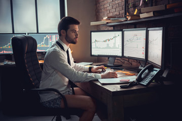 Concentrated businessman or stock broker over forex chart projection