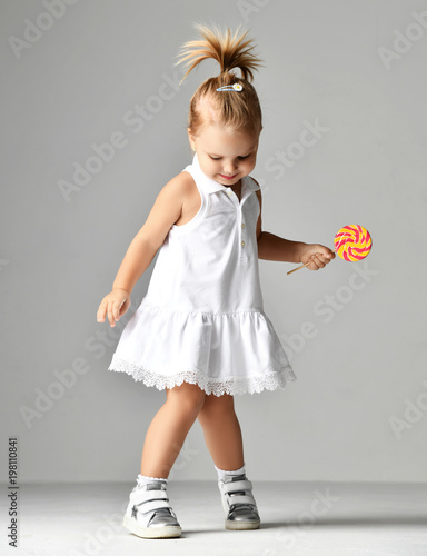 Young Pretty Toddler Girl Kid With Big Sweet Lollypop Candy
