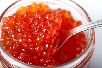Spoon with red caviar. Close-up.