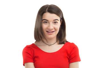 Fototapeta premium Closeup portrait of a beautiful happy smiling young girl, wearing red t-shirt, white background