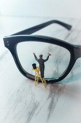 Tiny Figurine Cleans Eye Glasses