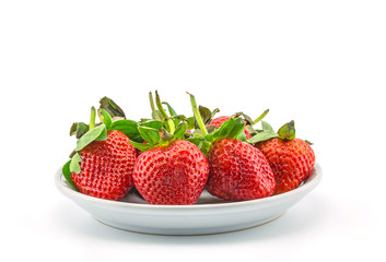 fresh strawberries on plate on white background