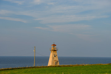 Fototapeta na wymiar The square-tapered and shingled Cape Tryon Lighthouse on Prince Edward Island