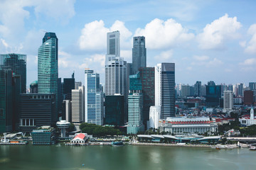 Beautiful super wide-angle summer aerial view of Singapore, with skyline, bay and scenery beyond the city, seen from the observation deck