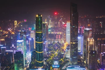 Tuinposter Beautiful wide-angle night aerial view of Guangzhou Zhujiang New Town financial district, Guangdong, China with skyline and scenery beyond the city, seen from the observation deck of Canton Tower   © tsuguliev