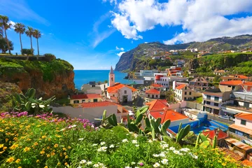 Fotobehang Beautiful panorama over the cityscape of Camara de Lobos in Madeira island, Portugal © cristianbalate