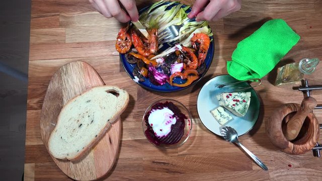 Top view prepare serving plate with shrimps, andive, beet salad and moldy cheese.