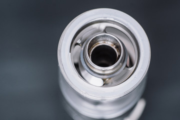 vape smoking an electronic cigarette, runs vape juice electronic cigarette. He holds a mechanical...
