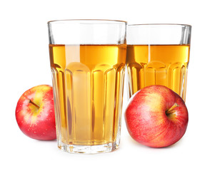 Glasses of juice and fresh apples on white background