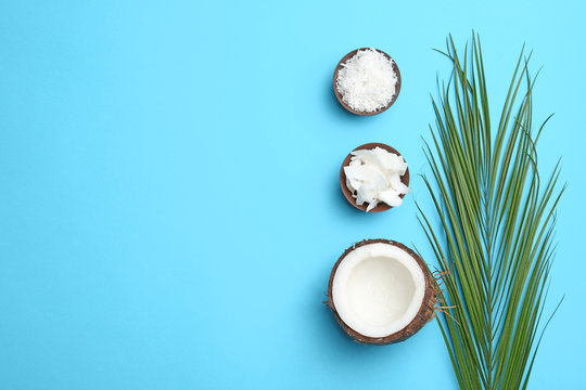 Composition with coconut flakes on color background, top view