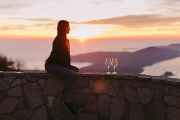 woman relax in mountains at sunset