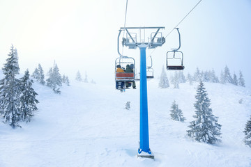 Ski lift at mountain resort. Winter vacation