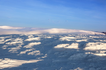 Beautiful snowy mountain peak on winter day