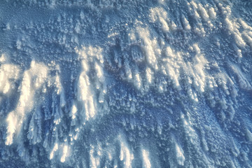 Shiny ice covered snow in wintertime