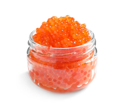 Jar with delicious red caviar on white background