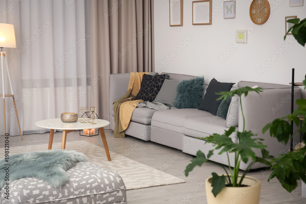 Sticker Modern living room interior with comfortable sofa and small table