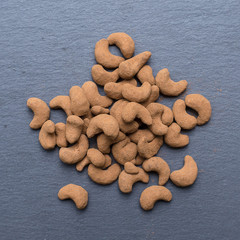 Cashew nuts covered with cocoa powder, close up . Balinese dessert, Indonesia, island Bali