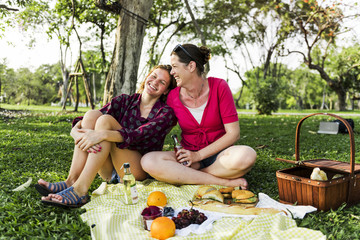 Mother and daughter having a picninc in the park