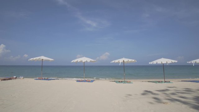 Tourist Sunbathing on Tropical Surin Beach, Phuket, Thailand
