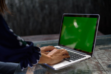 Asian woman working in coffee shop.
