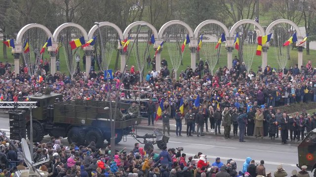 Military trucks marching at the National Day parade in Alba Iulia
