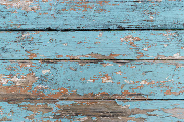Blue pattern on wood with other blue and yellow hues