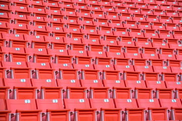 Fototapeta premium Many orange chairs in football stadium.